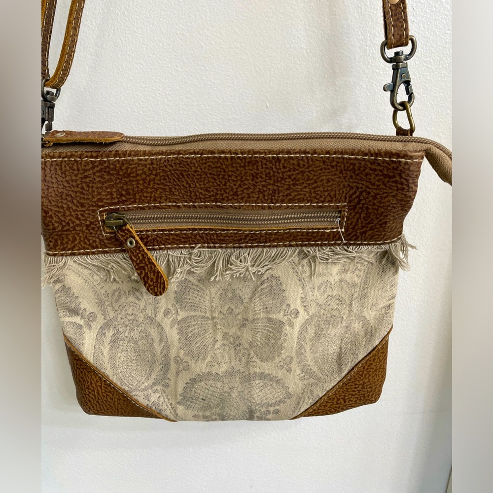 Myra crossbody.  2 zippered pockets outside and 2 sections inside